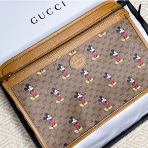 Replica Gucci 602552 Disney x Gucci pouch in Beige/ebony mini GG Supreme canvas