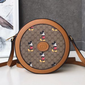 Replica Gucci 603938 Disney x Gucci round shoulder bag in Beige/ebony mini GG Supreme canvas