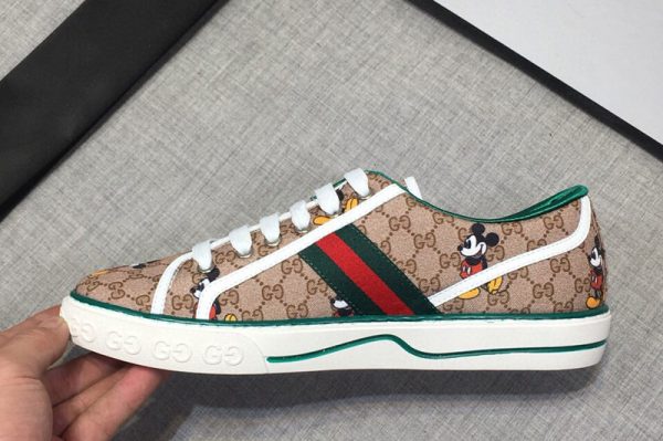 Replica Mens and Womens Gucci 606111 Disney x Gucci Tennis 1977 sneaker with Web in Beige GG Supreme