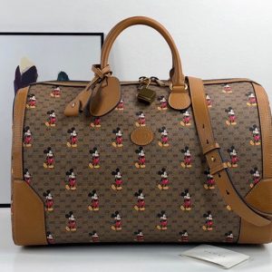 Replica Gucci ‎547953 Disney x Gucci medium carry-on duffle Bag in Beige/ebony mini GG Supreme canvas with Mickey Mouse