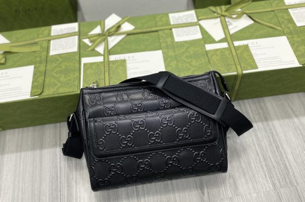 Replica Gucci 658565 GG embossed messenger bag in Black GG embossed leather