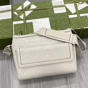 Replica Gucci 658565 GG embossed messenger bag in White GG embossed leather