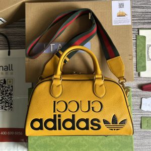 Replica adidas x Gucci 702397 mini duffle bag in Orange and Black leather